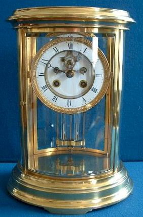 A good quality French Clock circa 1890 in a gilt-brass four-glass case of oval form. — Antique Clocks Price Guide