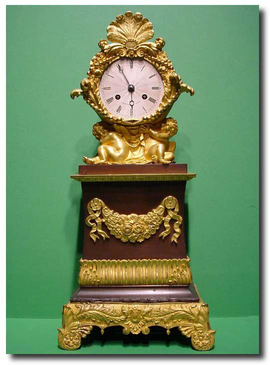 French First Empire gilt ormolu mantel clock, circa 1830 — Antique Clocks Price Guide