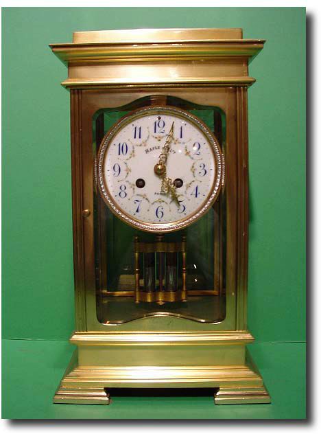A solidly cast gilt bronze four glass clock by "Maple and Co Ltd.", Paris, circa 1900 — Antique Clocks Price Guide