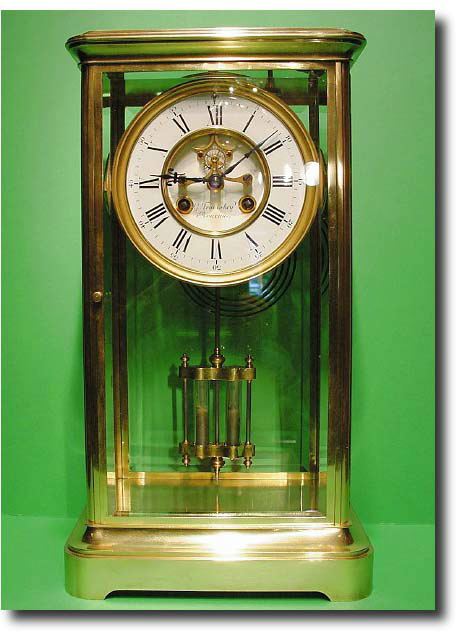 An unusually large French corniche cased brass four glass clock, circa 1870 — Antique Clocks Price Guide