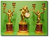 French gilt bronze and rouge marble three piece drummer boy timepiece clock garniture, Circa 1860.