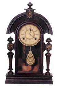 Ansonia Clock Co. "King", ca 1901. 22 inch black walnut case, never refinished or cleaned, metal lions head ornaments on the posts and a ladies bust on top. — Antique Clocks Price Guide