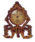 Waterbury Clock Co. novelty, ormolu gold plated case is 5 inches high, with an easel stand. — Antique Clocks Price Guide