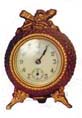 Jennings Bros. novelty clock. 4 inch case has been repainted, has an easel stand. — Antique Clocks Price Guide