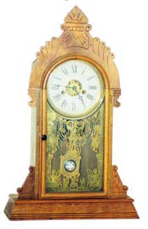E.N. Welch walnut parlor clock, walnut case 21 inches high. — Antique Clocks Price Guide