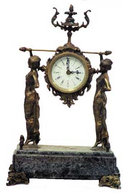 Bronze and marble French clock. The clock is being carried by 2 Egyptian ladies. — Antique Clocks Price Guide