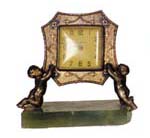 New Haven novelty clock, cupids holding the clock while kneeling on a block of green onyx, — Antique Clocks Price Guide