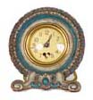 National Clock Co. "Beating Heart" clock. Made of a wood product, carved and hand decorated, easel back. — Antique Clocks Price Guide