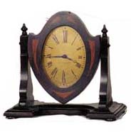 Seth Thomas "No. 2 Boudoir", ca 1928. A swinging frame clock of two tone mahogany, 9 1/2 inches wide, 9 1/4 inches high. — Antique Clocks Price Guide