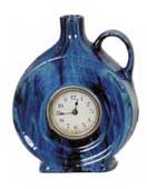 Lux Clock Co. blue ceramic "Jug" clock, 7 inches high. — Antique Clocks Price Guide