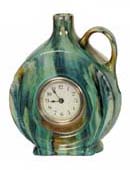 Lux Clock Co. green ceramic "Jug" clock, 7 inches high. — Antique Clocks Price Guide