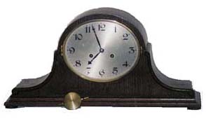 Junghans shelf clock in a tambour style case. — Antique Clocks Price Guide
