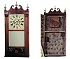 Reeded pilaster and scroll top looking glass clock.