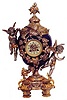 French cobalt blue porcelain urn complete with original base, top, and other ornaments, winged cherubs and dove.