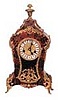 Kienzle-Germany, ca 1920's. Boulle style mantle clock with a plethora of bronze ornaments and inlay on 3 sides of the wood case.