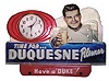 Advertising clock for "Duquesne Pilsner" beer. The metal case is 13inches wide and 9 inches high.