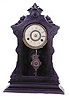 New Haven shelf clock. Case has been stained very dark, it is probably walnut underneath.