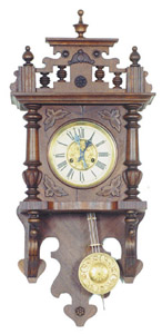 German open swinger with half columns, — Antique Clocks Price Guide
