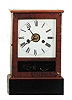 The Terry Clock Co., Waterbury, Conn., ca 1873. This 12 inch walnut clock is called "Cottage No. 2".