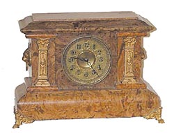 Seth Thomas mantle clock, adamantine case in brown tones, — Antique Clocks Price Guide
