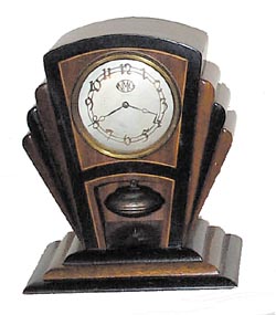 National Magnetic Clock Co., "Torsion Pendulum", art deco style with a disc pendulum. — Antique Clocks Price Guide