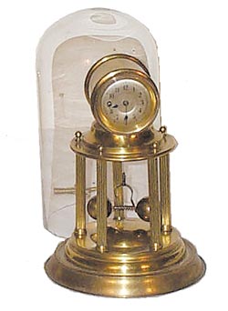 German Torsion Rotary, spring driven. Brass case with glass dome. — Antique Clocks Price Guide