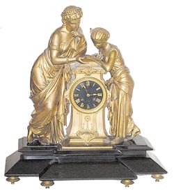 French statue on a black onyx base. — Antique Clocks Price Guide