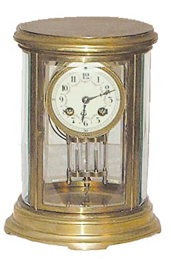 French Oval crystal regulator. 8 day movement is signed, "Made in France", and "L. Marti & Sons". — Antique Clocks Price Guide