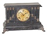Gilbert Clock Co. Black wood case with unusual look of stepped columns.