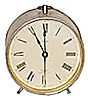 Parker Clock Co. alarm clock in a nickel case, brass bell on the back, running.