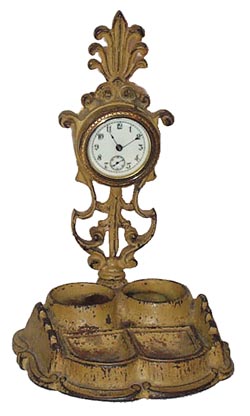 Inkstand clock, ca early 1900Õs. Metal case is 10.5" high, missing the ink bottles. — Antique Clocks Price Guide