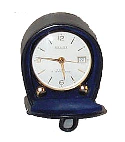 Swiss travel alarm clock in a leather case. — Antique Clocks Price Guide