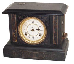 Waterbury Clock Co. "Gamblers Clock", in a regular black case adapted to accommodate the gambler movement and money slots. — Antique Clocks Price Guide