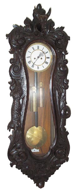 Rare carved Vienna Regulator in the Serpentine style. — Antique Clocks Price Guide