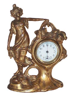 Unsigned novelty. Typical metal case had gold wash originally, now about half worn off, but still attractive. — Antique Clocks Price Guide