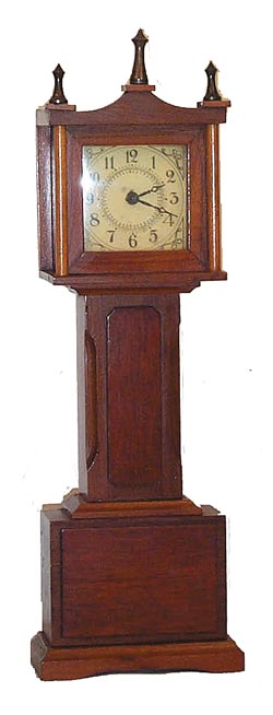 Miniature grandfather clock made by the Burroughs Company. — Antique Clocks Price Guide