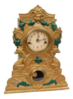 Waterbury Clock Co., Sales Room, New York City, reads the label inside this iron front clock. Iron case is signed, "N. Mueller No. 12". — Antique Clocks Price Guide