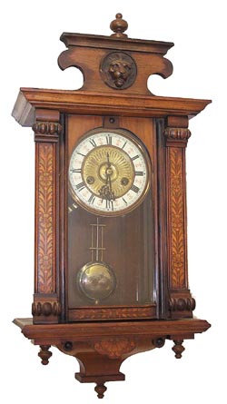 German mini RA with some awesome wood treatments on the front of the case. — Antique Clocks Price Guide