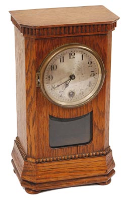 German mini-mini clock. Great little oak case, 8" by 4.5", dentiltype molding around the top, ripple type around the base, beveled moldingjust below the ripple, 4 round wood feet. — Antique Clocks Price Guide
