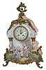 Very large French porcelain clock with attached cast bronze ornaments from the feet to the top. Hand painted scenes signed by "Petit".