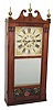 Reeded pilaster and scroll top, looking glass clock.