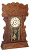Wm. L. Gilbert Clock Co. oak kitchen clock, one of the "Author Sets, Pattern No. 160", ca 1913.