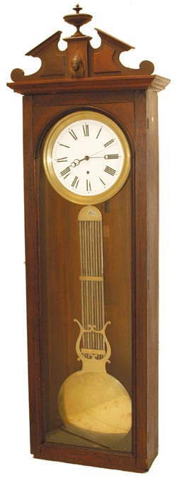Swiss Pinwheel, C. 1890. The old walnut case stands 69" without a base. — Antique Clocks Price Guide