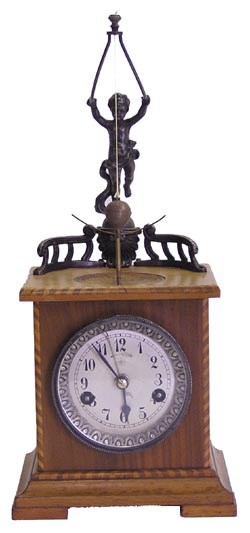 Junghans Conical Pendulum Alarm Clock. — Antique Clocks Price Guide