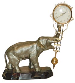 Linden swinging arm with a metal elephant and base. — Antique Clocks Price Guide