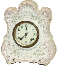 American-English, china clock. Unsigned anywhere but the nickel movement plates say that American and English Patents Applied For. — Antique Clocks Price Guide