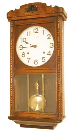 Japanese box clock, 23" high walnut case with ripple molding on the door. — Antique Clocks Price Guide