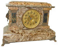Seth Thomas adamantine finished mantle clock, brown and tan, dark green adamantine onyx columns, lions heads on the ends. — Antique Clocks Price Guide