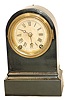 Terry Clock Co. enameled iron case, 8" high. 30 hour, time and strike.