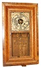 Wm. L. Gilbert 30 hour OG, brass movement, weight driven. 26" high mixed wood case, possibly rosewood on the door and outside of case, and a veneer on the curve that is unfamiliar to me but is very attractive.